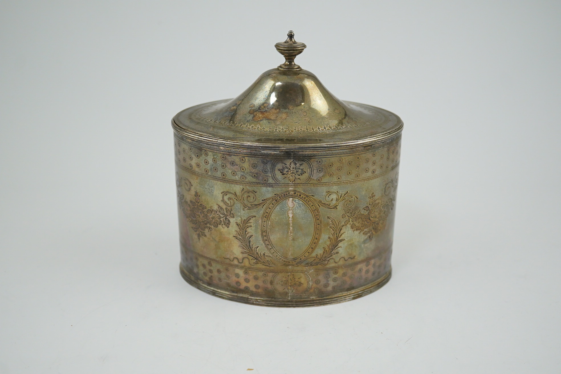 A George III silver oval tea caddy by Hester Bateman